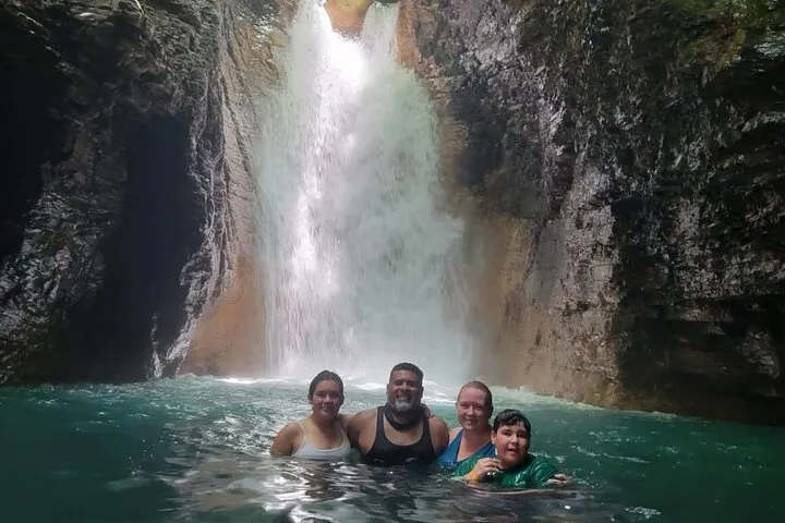 Waterfall pool along the hiking trail before a hot springs soak on a La Leona waterfall hot springs tour in Guanacaste, Costa Rica