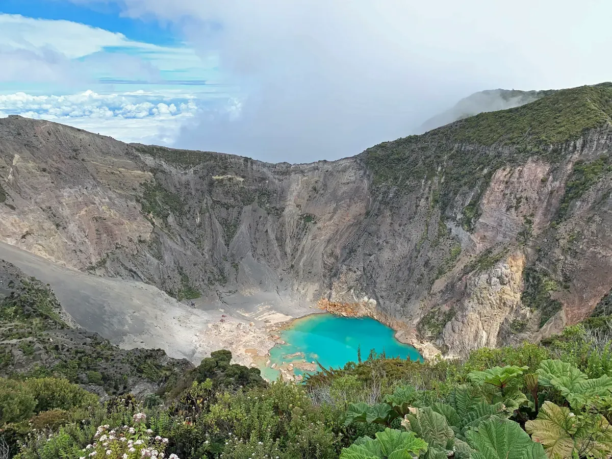 The turquoise crater lake of Irazú Volcano, the first stop on a Costa Rica hot springs tour to Orosi