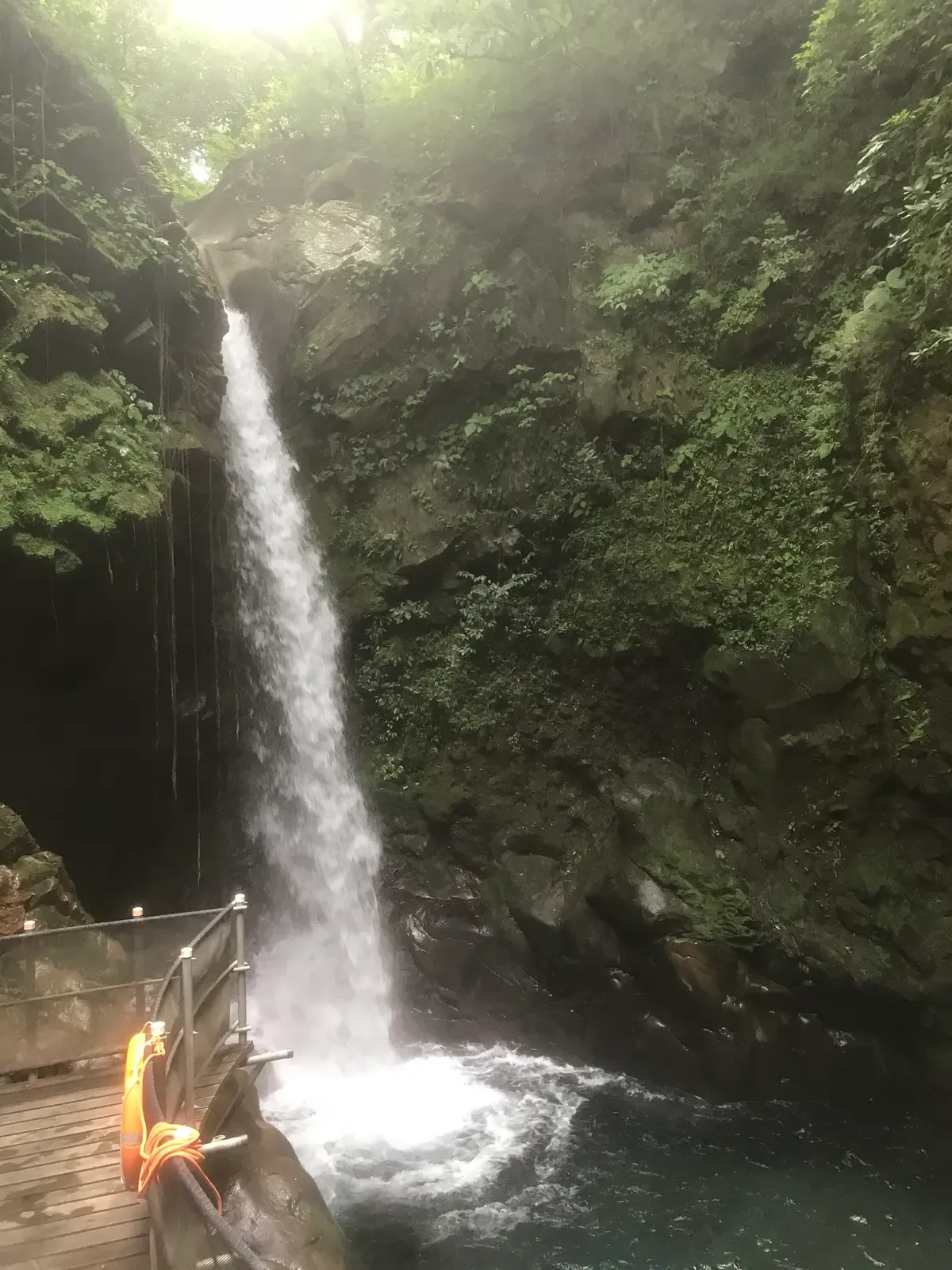 The Oropendola Waterfall falling into a pool at Rincón de la Vieja, a stop on Costa Rica hot springs tours