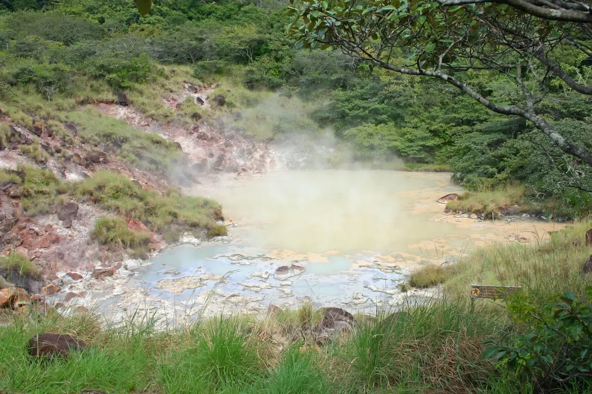A steaming hot spring pool in Rincón de la Vieja National Park, the volcano behind Costa Rica hot springs tours in Guanacaste